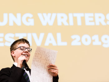 Young Writers' Festival 2019 - boy reading on stage